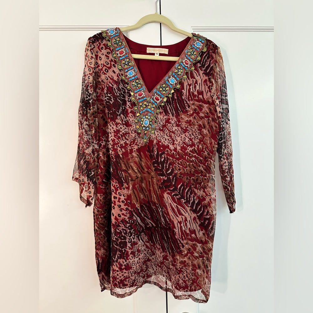 Red with print tunic. Festive with beautiful work